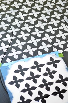 This painted stencil cement floor looks stunning in the patio makeover by Shavonda Gardner of SG Style. See how beautifully it coordinates with a lattice privacy screen. It's part of the Patio Style Challenge on The Home Depot Blog. || @SG_Style